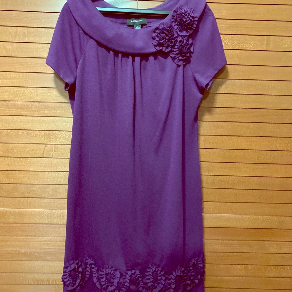 Purple knee length dress with flower detail